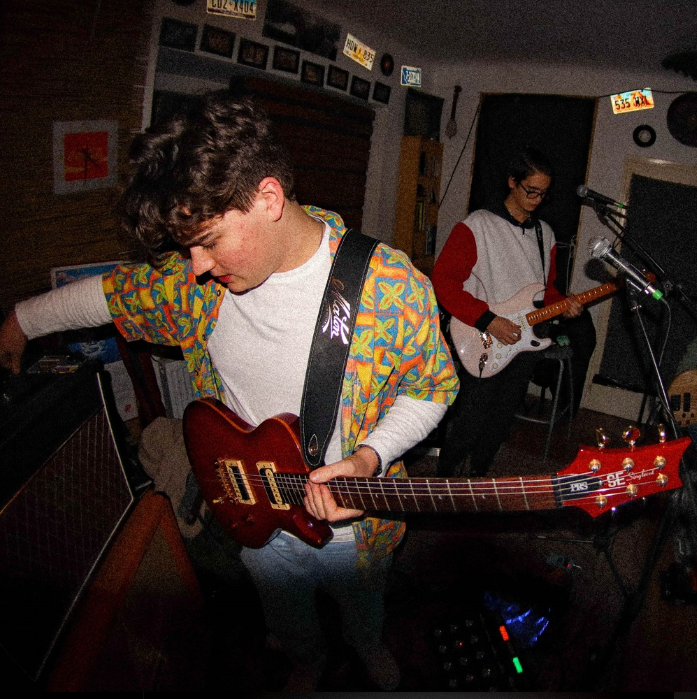 See Levente and Kristof in their studio, practicing in their instrument, which is guitar.